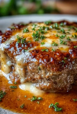 Delicious Amish style Hamburger Steak Bake served on a rustic plate.
