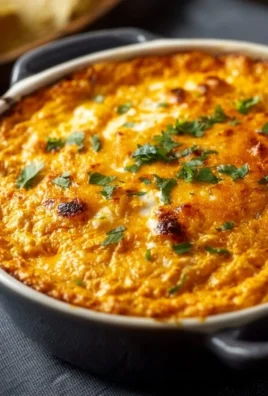 Buffalo Chicken Dip served in a bowl with tortilla chips for game day.