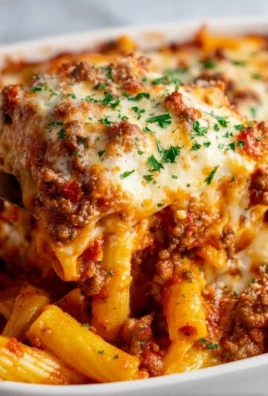 Serving of easy baked ziti with cheese and marinara sauce.