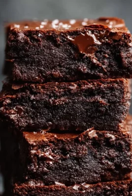 Decadent fudgy brown butter brownies on a white plate