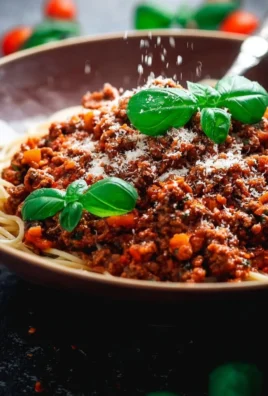 Homemade Bolognese sauce simmering in a pot, ready for pasta