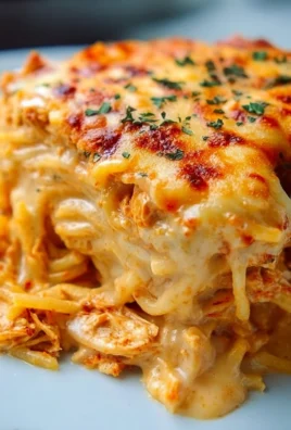 Spicy Southern cheesy chicken spaghetti casserole topped with melted cheese