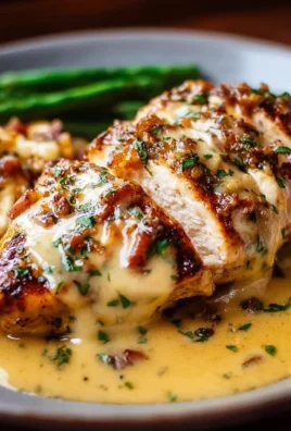 Delicious Texas Roadhouse smothered chicken with jack cheese served on a plate