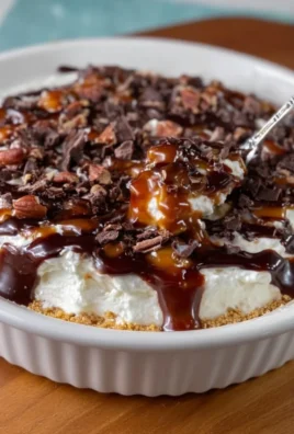 Delicious Turtle Cheesecake Dip with chocolate and caramel toppings