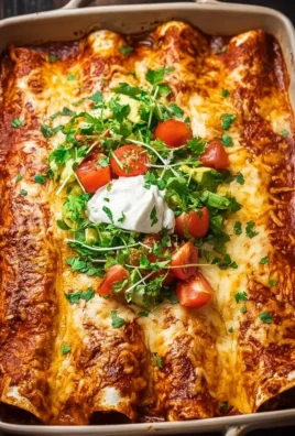 Ultimate quick and easy chicken enchiladas topped with cheese and salsa.