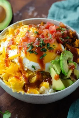 Delicious breakfast burrito bowl filled with eggs, veggies, and salsa