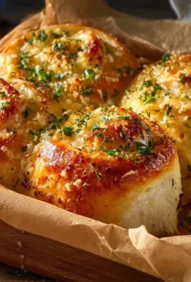 Buttery cheese garlic rolls fresh out of the oven, golden and delicious.