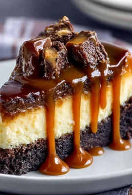 Delicious caramel brownie cheesecake with chocolate layers and caramel drizzle