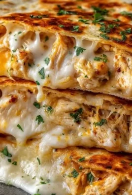 Cheesy garlic chicken wraps served with fresh vegetables and dipping sauce