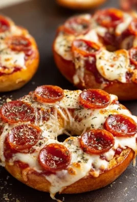 Delicious easy homemade pizza bagels topped with cheese and pepperoni