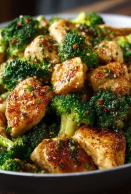 Delicious Garlic Butter Chicken served with fresh broccoli on a plate.