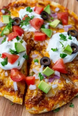 Homemade Mexican Pizza inspired by Taco Bell recipe with toppings.