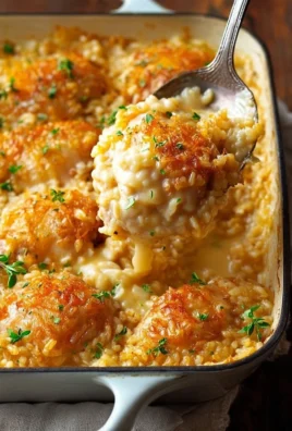 One-pan chicken and rice bake served on a plate with fresh herbs and vegetables.