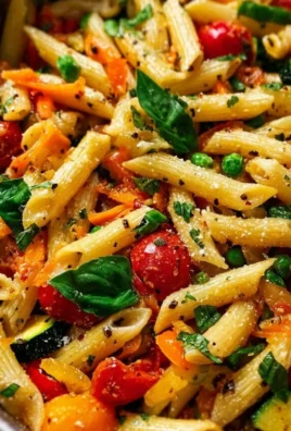 One Pot Veggie Pasta with colorful vegetables in a bowl.