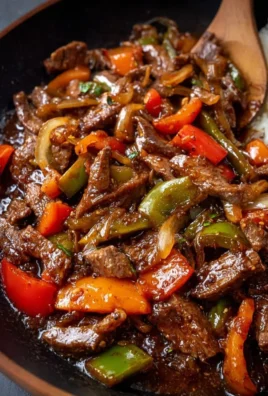 Delicious homemade pepper steak served with colorful bell peppers and tender beef.