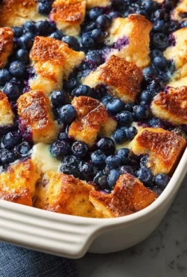 Delicious blueberry french toast casserole topped with fresh blueberries and syrup