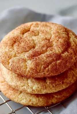 Plate of freshly baked sourdough snickerdoodles with cinnamon sugar topping