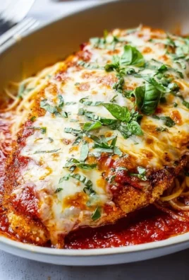 Delicious baked chicken parmesan topped with melted cheese and marinara sauce