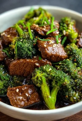 Delicious plate of beef and broccoli stir-fry with vibrant greens and savory sauce.
