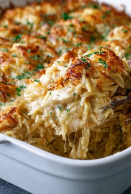 Delicious French Onion Chicken Orzo Casserole baked with melted cheese and onions