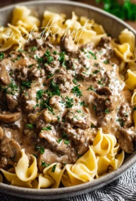 Delicious Ground Beef Stroganoff served in a creamy sauce over pasta