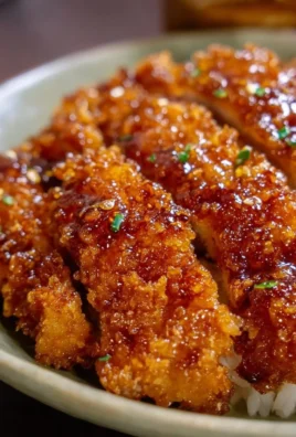 Honey Garlic Crispy Chicken dish served with garnishes