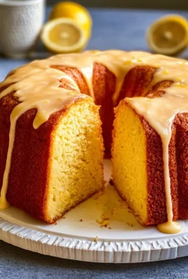 Delicious lemon cake with zesty frosting and fresh lemon slices on top