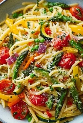 Pasta Primavera with seasonal vegetables in a colorful dish