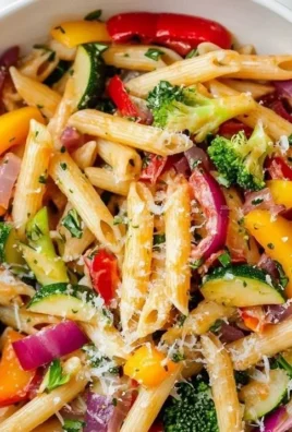 Vibrant Vegetarian Pasta Primavera with assorted vegetables on a plate