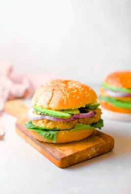 15-Minute chickpea burgers served on a plate with fresh toppings