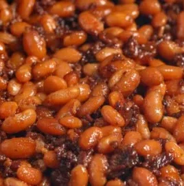 Delicious BBQ baked beans in a rustic bowl