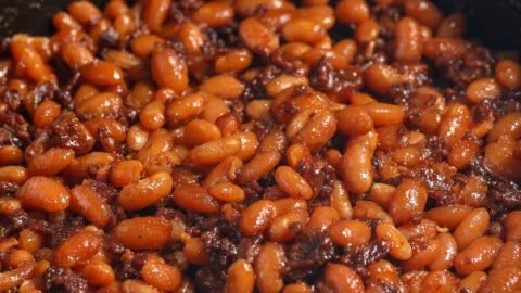 Delicious BBQ baked beans in a rustic bowl