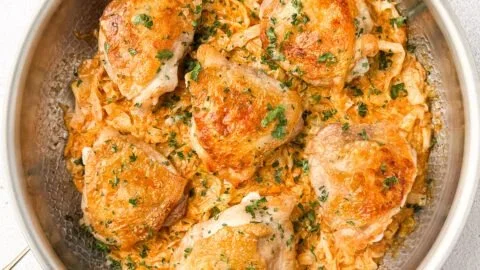 Cabbage Alfredo with Crispy Chicken served on a plate