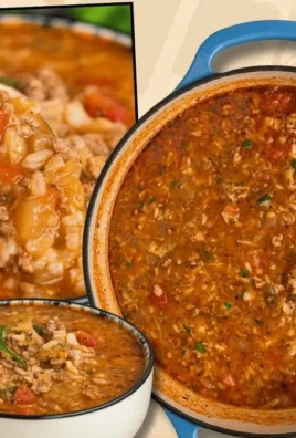 Delicious cabbage roll soup in a bowl, garnished with herbs and served hot.
