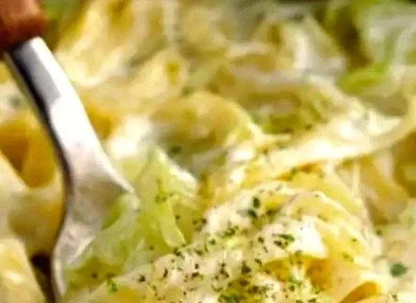 Creamy Alfredo Cabbage Pasta served in a bowl with parsley garnish