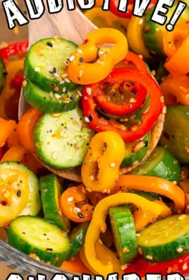 Cucumber and sweet pepper salad in a bowl with fresh ingredients.