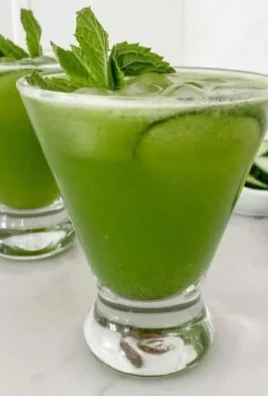 Refreshing Cucumber Mint Mocktail served in a glass with mint leaves and cucumber slices