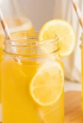 Refreshing homemade Meyer lemonade in a glass with lemon slices