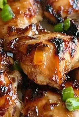 Succulent grilled teriyaki chicken with a glossy glaze on a serving plate