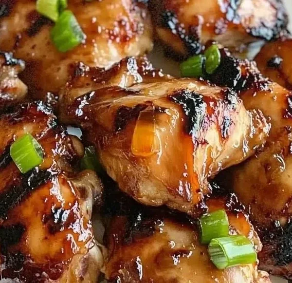 Succulent grilled teriyaki chicken with a glossy glaze on a serving plate