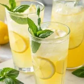 Homemade lemonade recipe with fresh lemons and ice for a refreshing drink