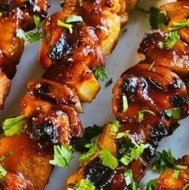 Huli Huli Chicken Kabobs marinated in a tangy Hawaiian sauce skewered and grilled.