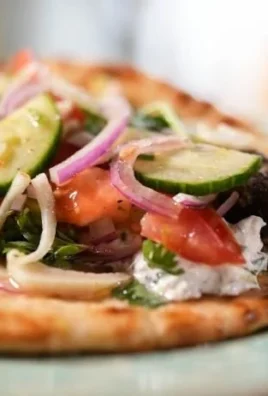 Tender lamb skewers served in pita bread with fresh toppings