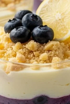 Lemon Blueberry Cheesecake Cups served in elegant glasses