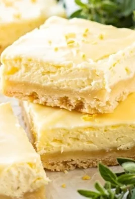 Homemade lemon nettle dessert bars garnished with fresh herbs.