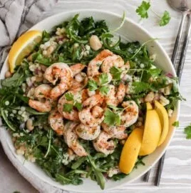 Shrimp couscous salad with fresh vegetables and zesty dressing
