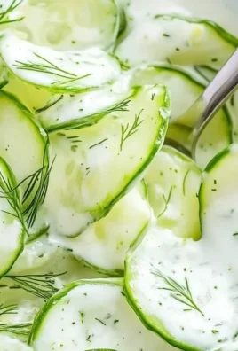Simple German cucumber salad with fresh ingredients, served in a bowl.
