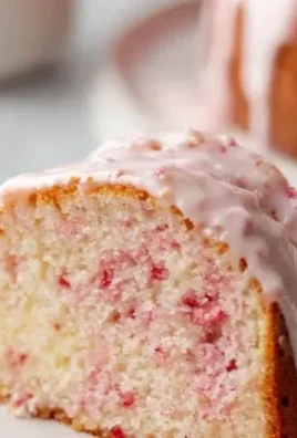 A slice of Strawberry Cream Cheese Pound Cake topped with fresh strawberries.