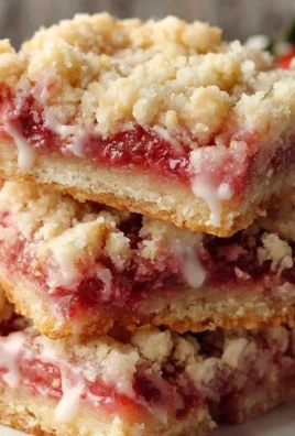 Delicious Strawberry Shortcake Bars on a white plate with fresh strawberries