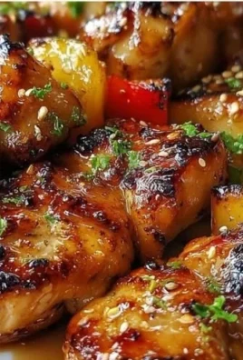 Delicious teriyaki chicken skewers glazed with sweet soy sauce on a grill